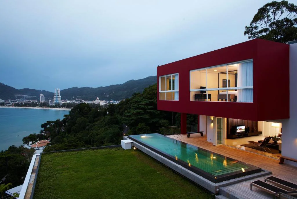 Two-story modern red villa with private infinity pool and Patong Bay sea view at Jirana Patong Phuket.