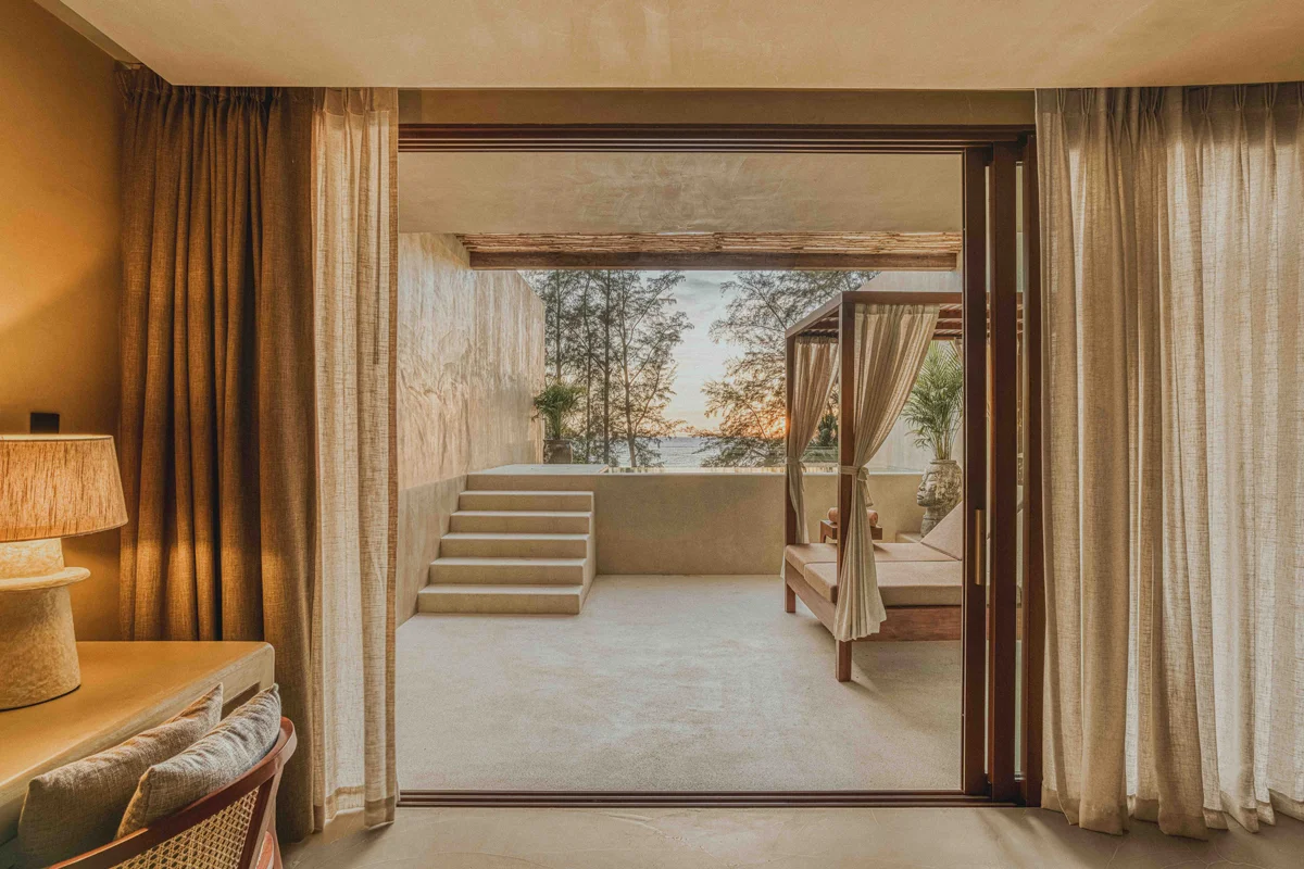 Cafe del Mar Phuket Suites and Penthouse second floor suite terrace with private pool, wooden daybed, and Kamala Beach ocean view.