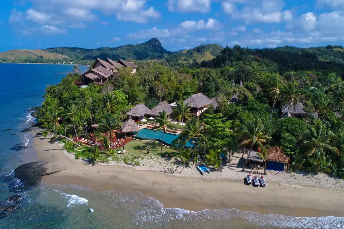 Aerial view of Nanuku Resort Fiji beach oceanfront villas and private pool in Pacific Harbour.