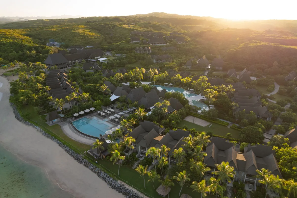 Aerial view of InterContinental Fiji Golf Resort & Spa showing the infinity pool, beachfront rooms, and Natadola Bay coastline