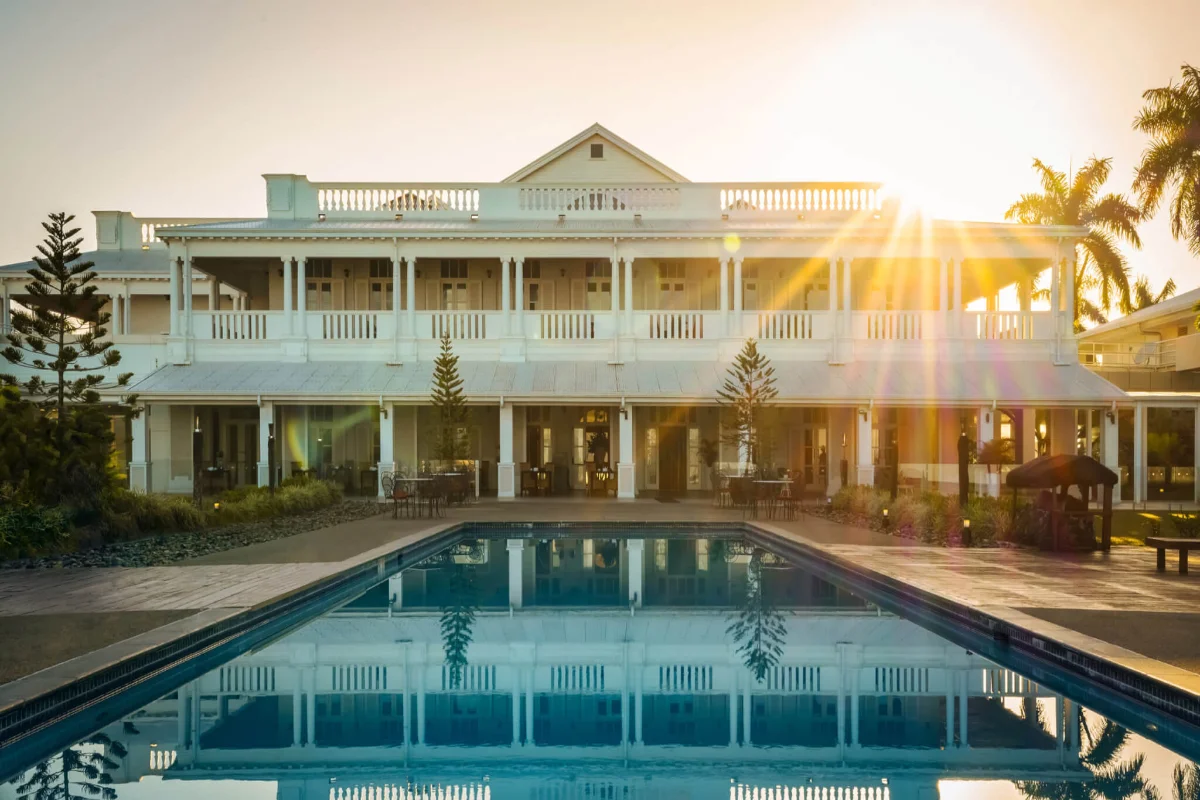 Colonial heritage facade and outdoor swimming pool at Grand Pacific Hotel by IHG in Suva Fiji