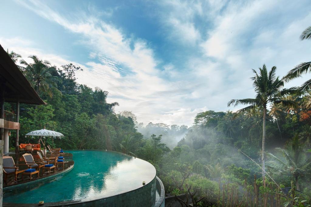 Main outdoor infinity swimming pool with jungle view at Natya Resort Ubud Tegallalang