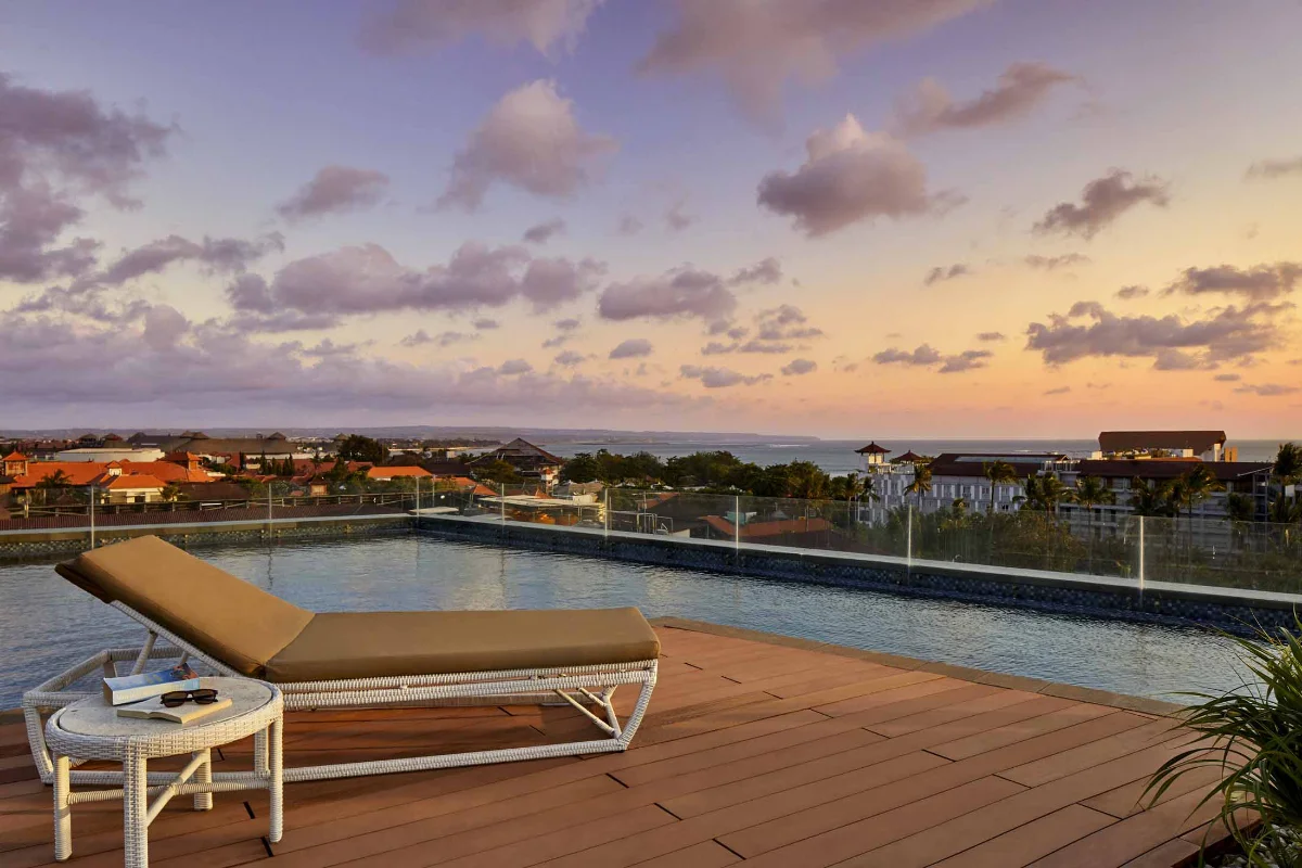 Private plunge pool suite terrace with ocean view at The Stones Hotel Legian Bali.