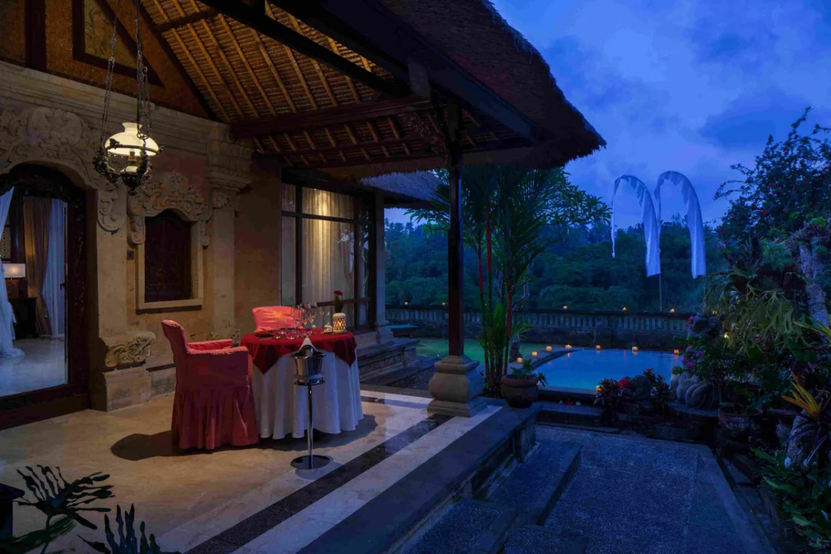 Private dining setup on the veranda of a Pool Duplex Villa at Pita Maha Resort & Spa Ubud with a private pool view.