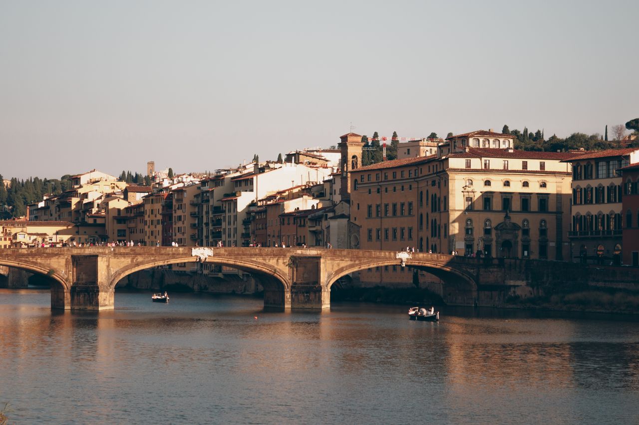 Tour guide and travelers boarding a day trip bus from Florence to Cinque Terre and Pisa