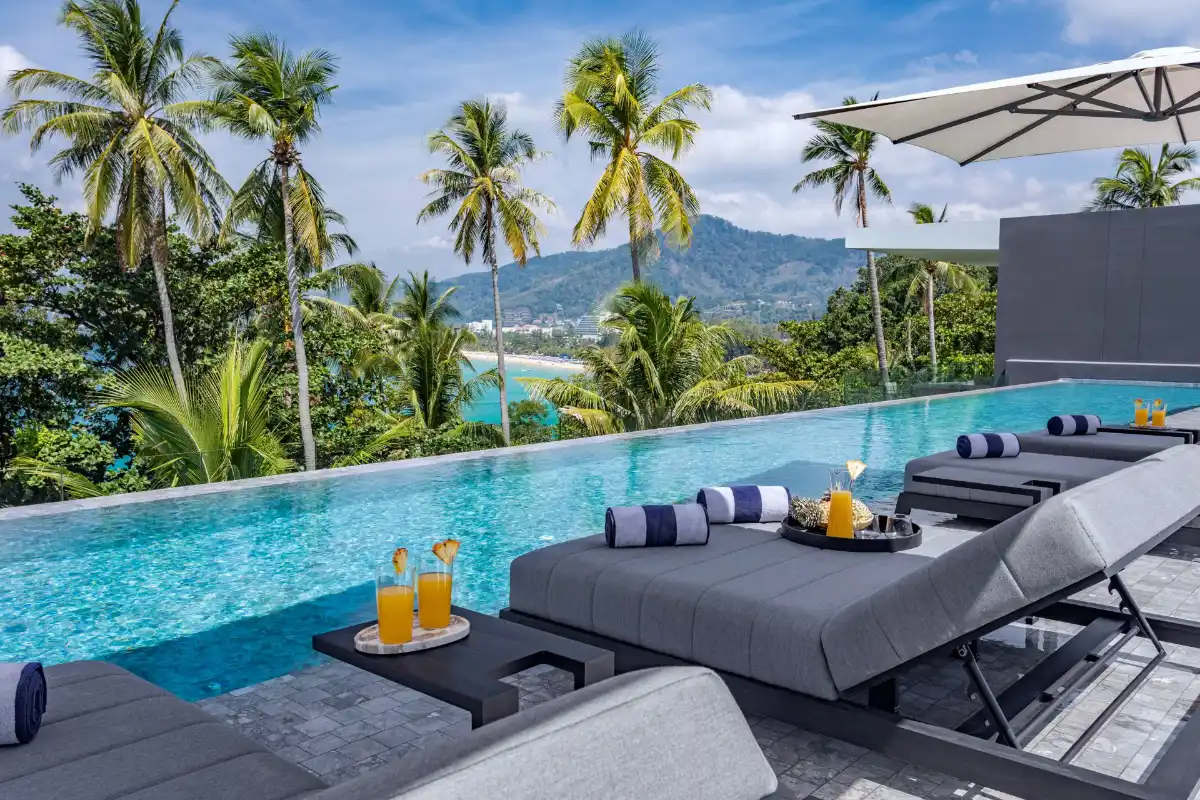 Rooftop infinity pool and sunbeds at Villa Zai overlooking Karon Beach Phuket
