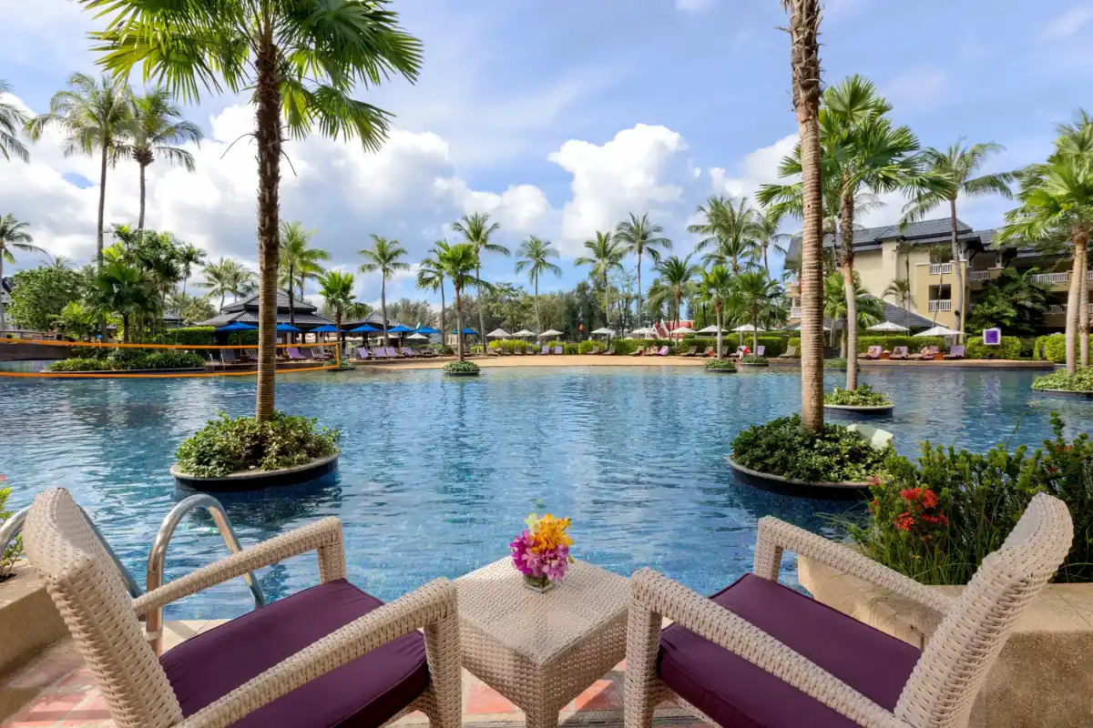 Seating area and loungers beside the 323-meter free-form outdoor pool at Angsana Laguna Phuket